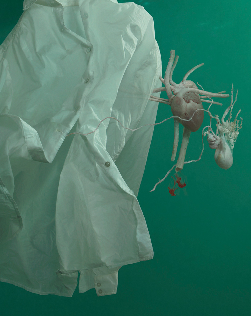 Illustration for article titled Human organs floating out of dress shirts, underwater